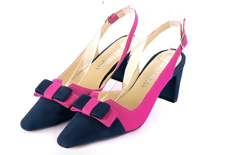 Navy blue and fuschia pink women's open back shoes, with a knot. Tapered toe. Medium comma heels. Front view - Florence KOOIJMAN